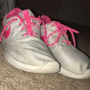 Pink and grey Nike roshes